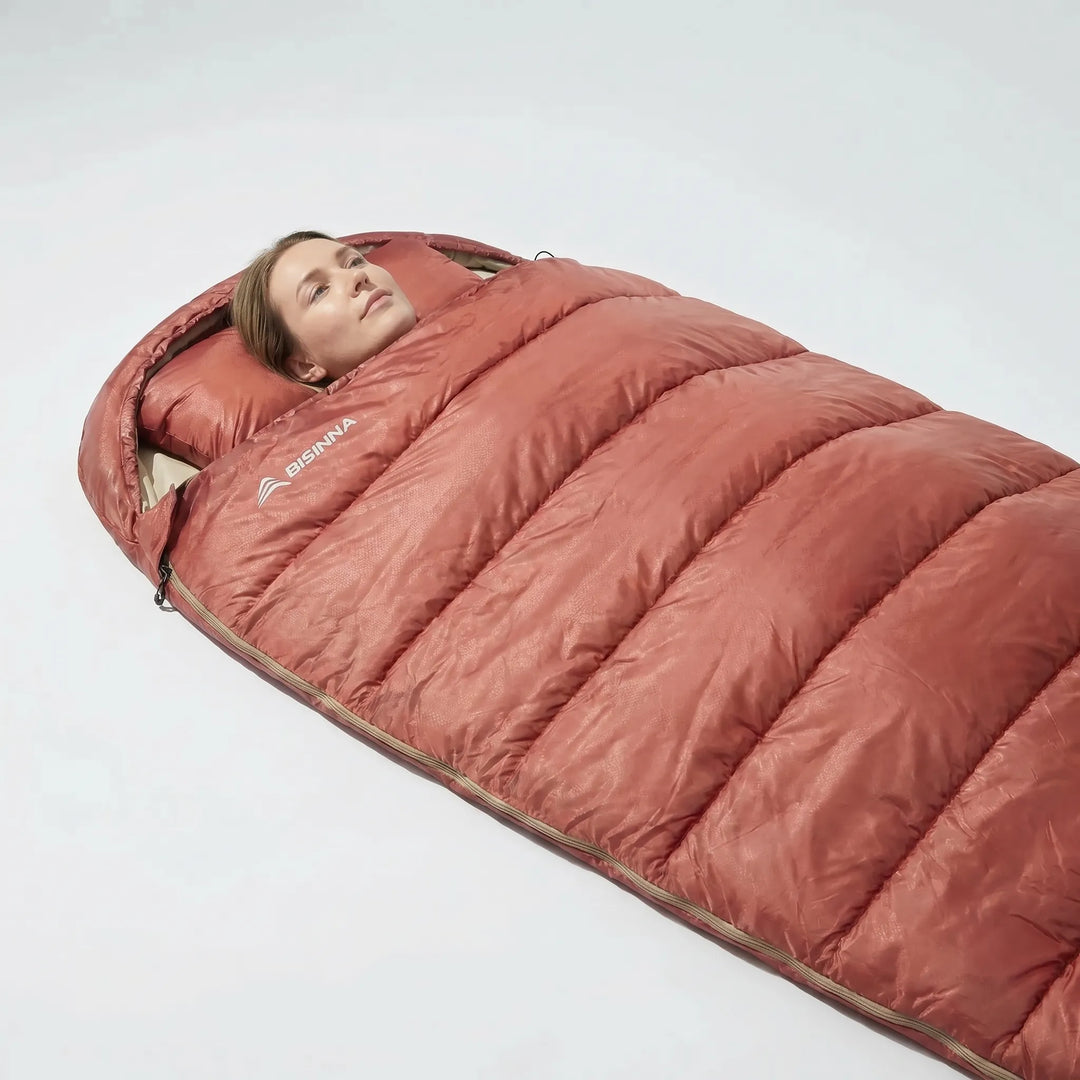 Roomy unisex wide sleeping bag for 3-season camping, offering comfortable space for adults outdoors.