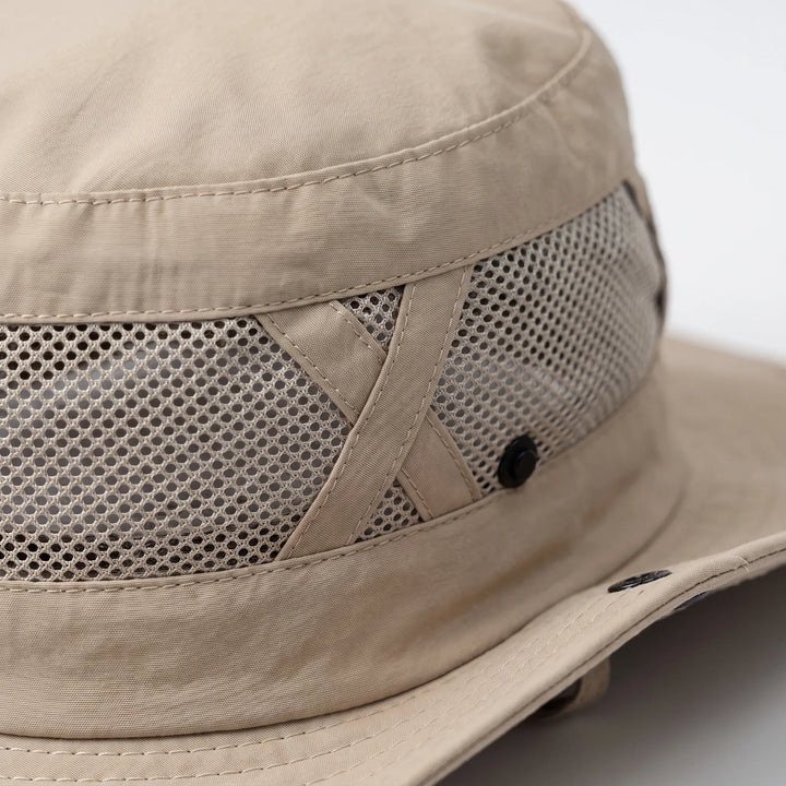 Unisex fishing hat with wide brim for hiking & outdoor adventures. Breathable sun protection.
