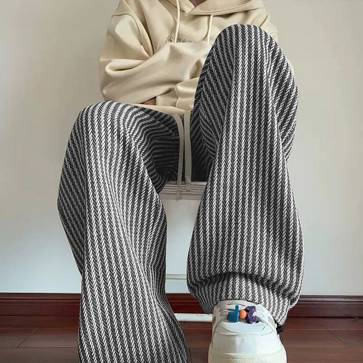 Unisex wide-leg herringbone sweatpants with drawstring for a relaxed, comfortable fit & modern casual style.
