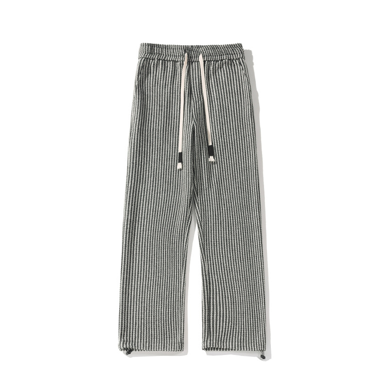 Stylish unisex wide-leg sweatpants with a distinctive herringbone pattern, perfect for comfortable, casual everyday fashion.