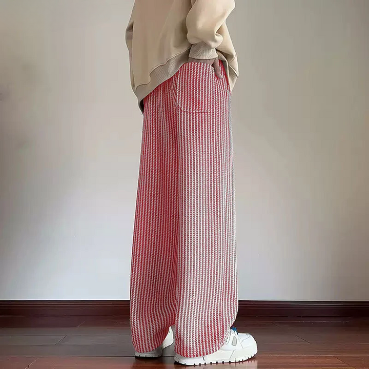 Comfortable unisex wide-leg herringbone sweatpants. Relaxed fit casual pants with drawstring for modern everyday style.