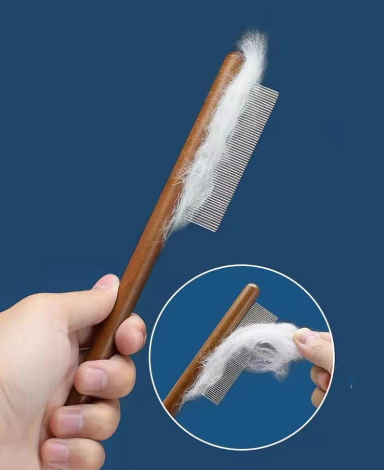 Hand holding wooden pet flea comb, unisex design for gentle pet grooming, promotes coat health, detangles