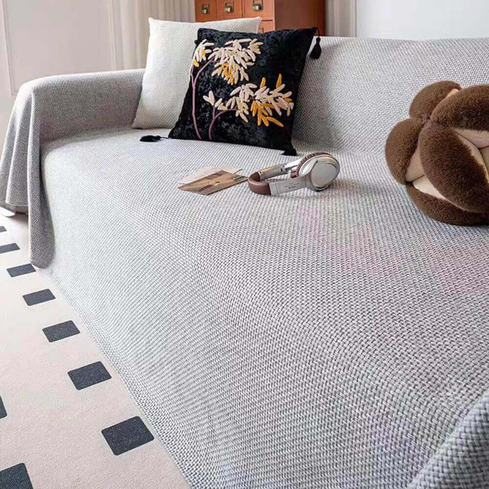 Neutral tone linen-look couch cover, pet-friendly and scratch-resistant, designed as a furniture protector.