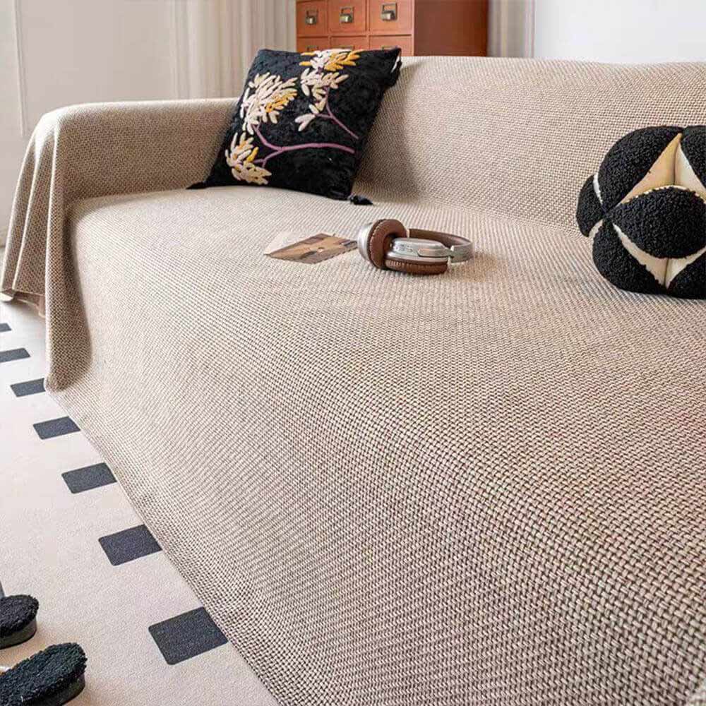 Close-up of reversible linen-look sofa throw, showing the quality weave and pet-friendly features.