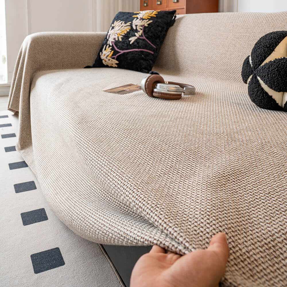 Modern linen-look couch cover, breathable and pet-friendly, a practical and stylish furniture accessory.