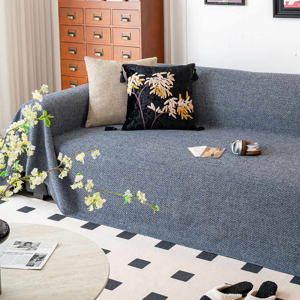 Linen-look pet-friendly couch cover draped on a sofa, offering scratch resistance and breathability.
