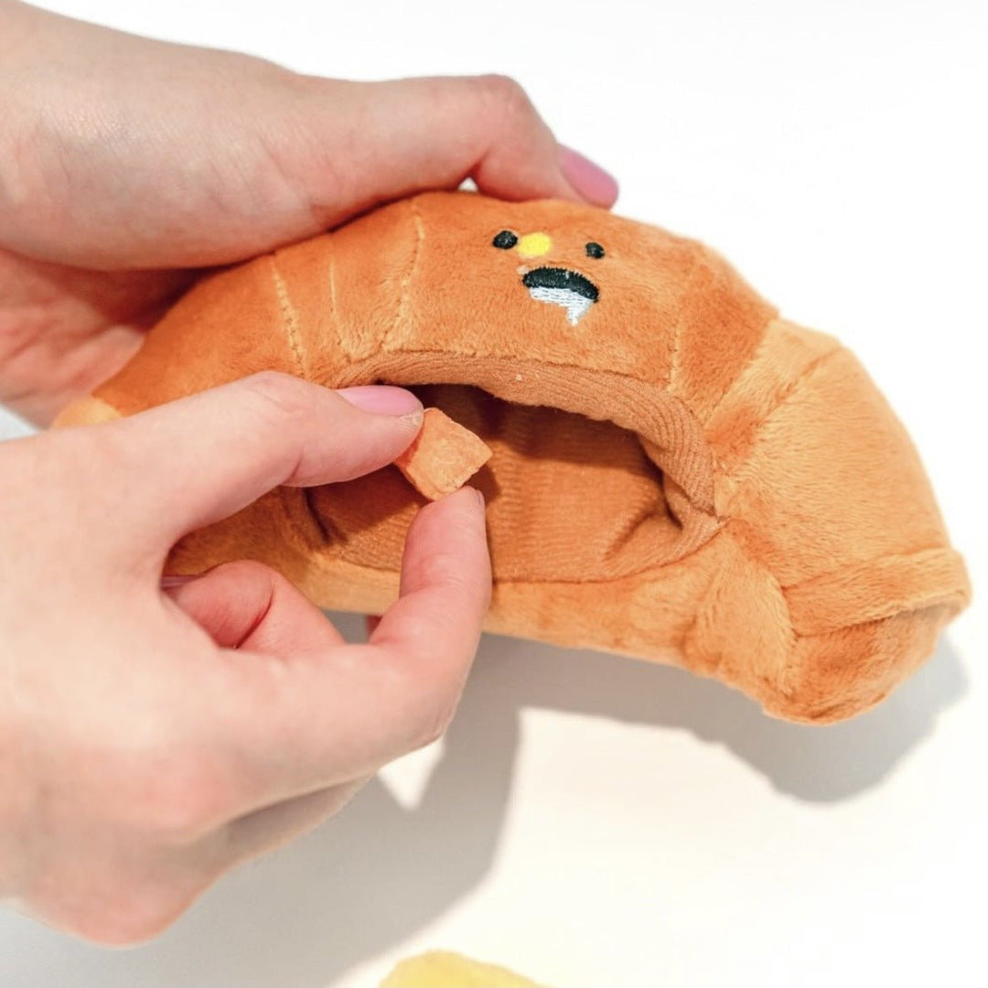 Unisex yellow plush croissant squeaky dog toy, durable for interactive pet play and fun.