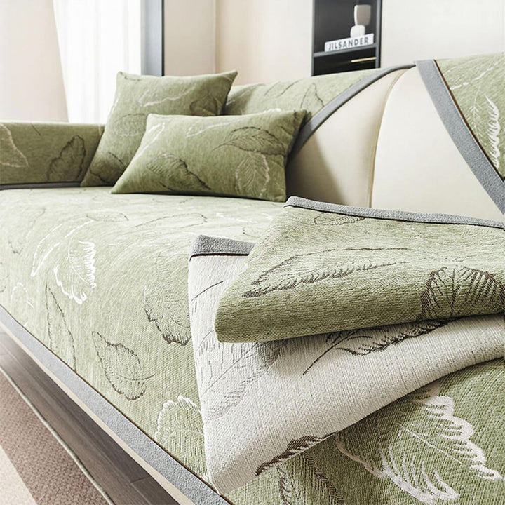Universal chenille sofa slipcover with intricate leaf texture, non-slip, perfect for pet-friendly homes.