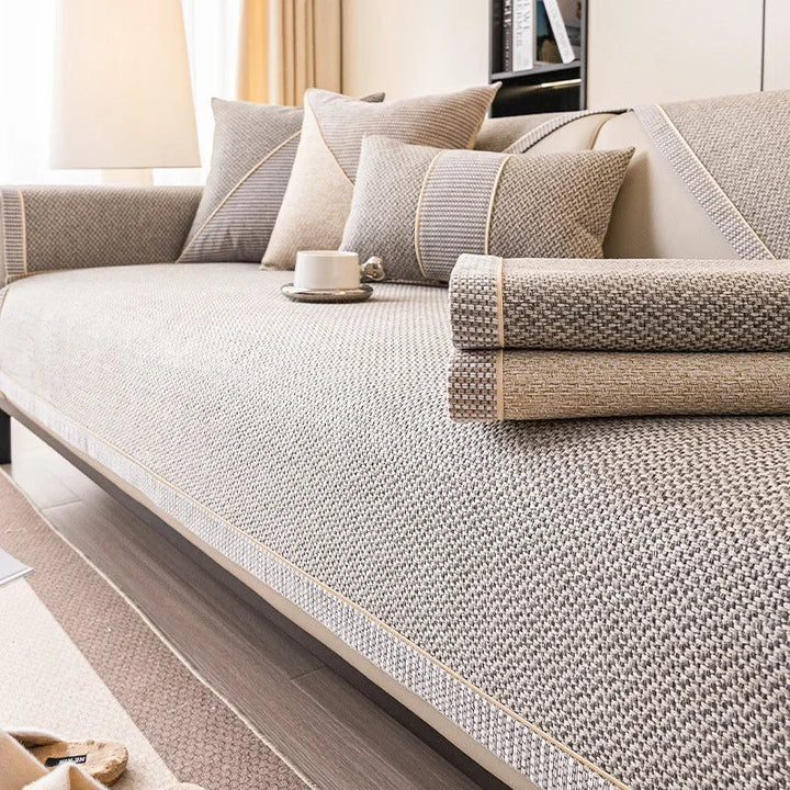 Stylish cotton-linen sofa cover, universal non-slip design, enhances living room decor all seasons.