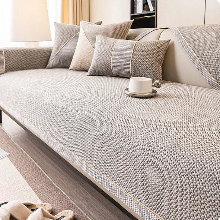 Breathable cotton-linen sofa cover, non-slip universal design, perfect furniture shield for any couch.