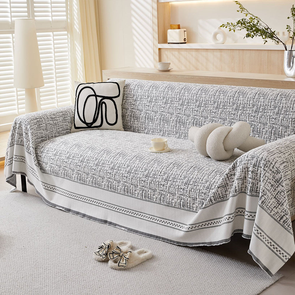 Universal ice silk cooling sofa cover in light grey, enhancing home decor & providing pet-friendly furniture protection