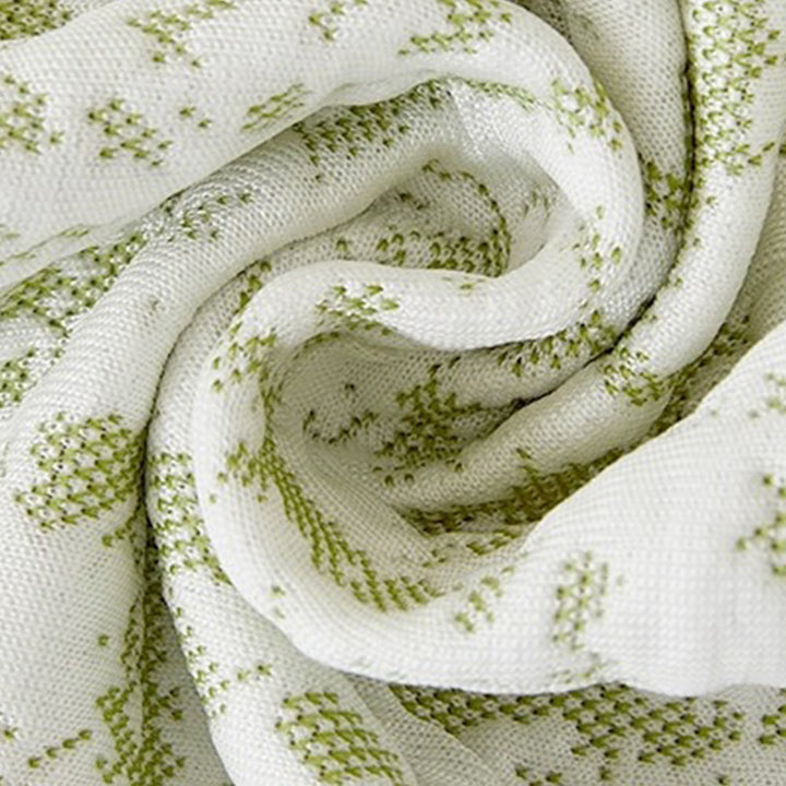 Detail shot of the elastic band on an ice silk sofa protector, ensuring a snug fit for furniture protection
