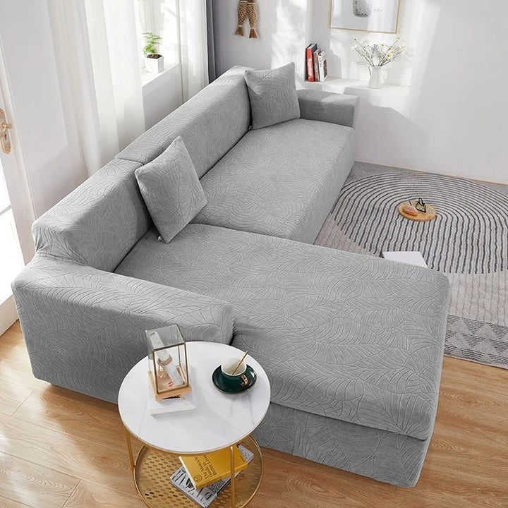 Durable polyester L-shape sectional slipcover, pet-friendly & washable couch cover for family living rooms.