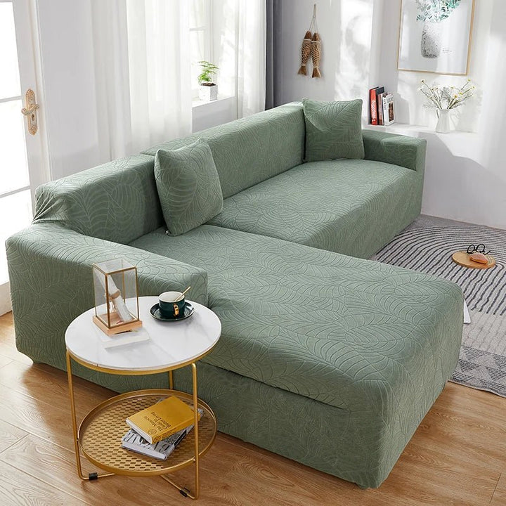 Modern L-shape sofa cover, stretchy polyester furniture protector, ideal for a stylish living room decor refresh.