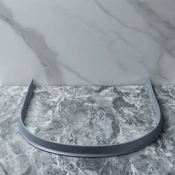 Universal silicone strip barrier, ideal for preventing water overflow in showers and wet spaces.