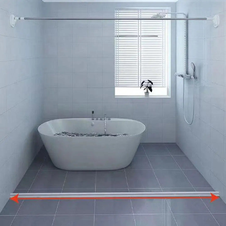 Self-adhesive silicone shower barrier for effective water containment and a tidy bathroom.