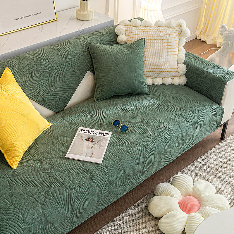 Soft cotton universal couch cover with anti-slip grip, perfect for protecting furniture and redecorating.