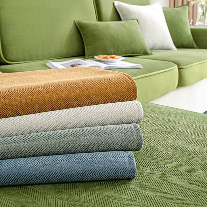 Universal stretch chenille herringbone sofa slipcover, black, offering a modern furniture refresh