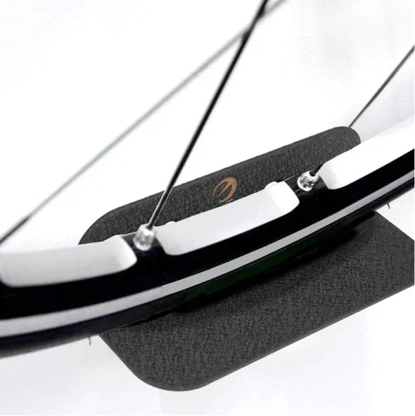 Universal bike hanger rack in carbon steel, ideal for home storage. A sturdy wall bike holder.