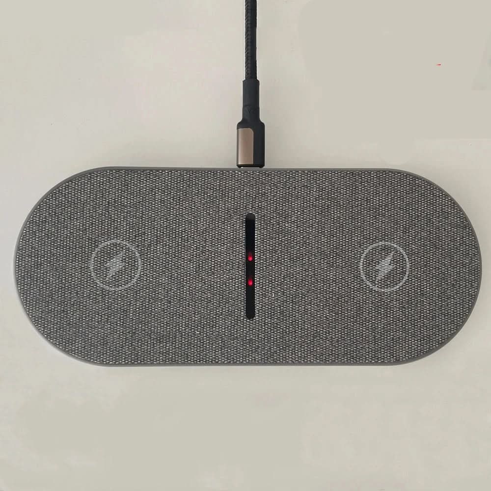 White universal fast wireless charging pad for all Qi-enabled iPhone and Android smartphones.