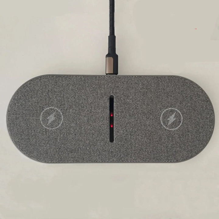 White universal fast wireless charging pad for all Qi-enabled iPhone and Android smartphones.