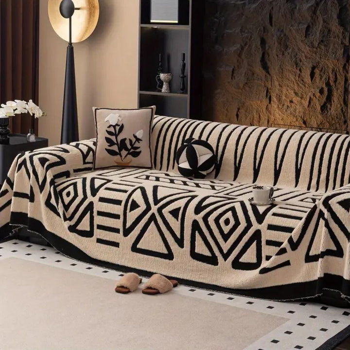 Urban Maze modern jacquard microfiber sofa cover protecting a living room sofa. Non-slip furniture protector.