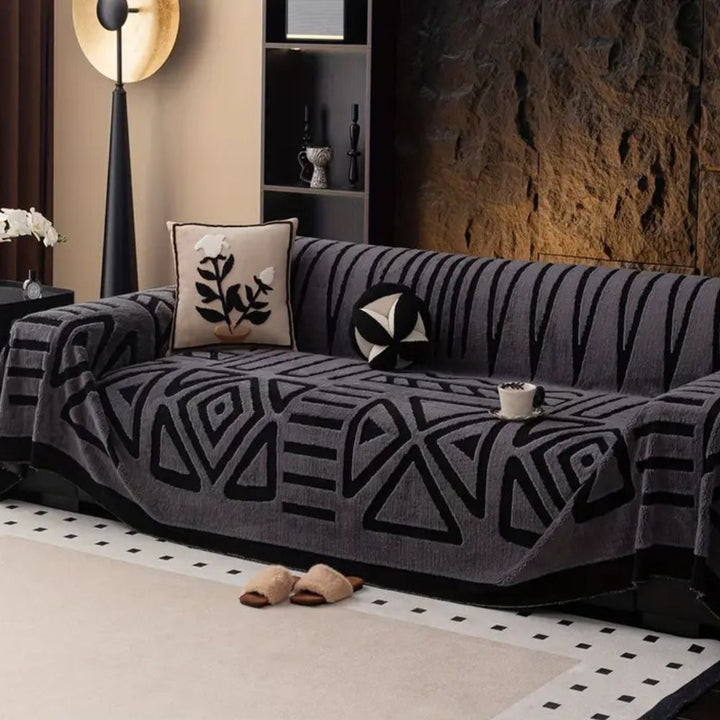 Close-up of Urban Maze jacquard microfiber sofa slipcover, showcasing modern texture & pet-friendly durability.