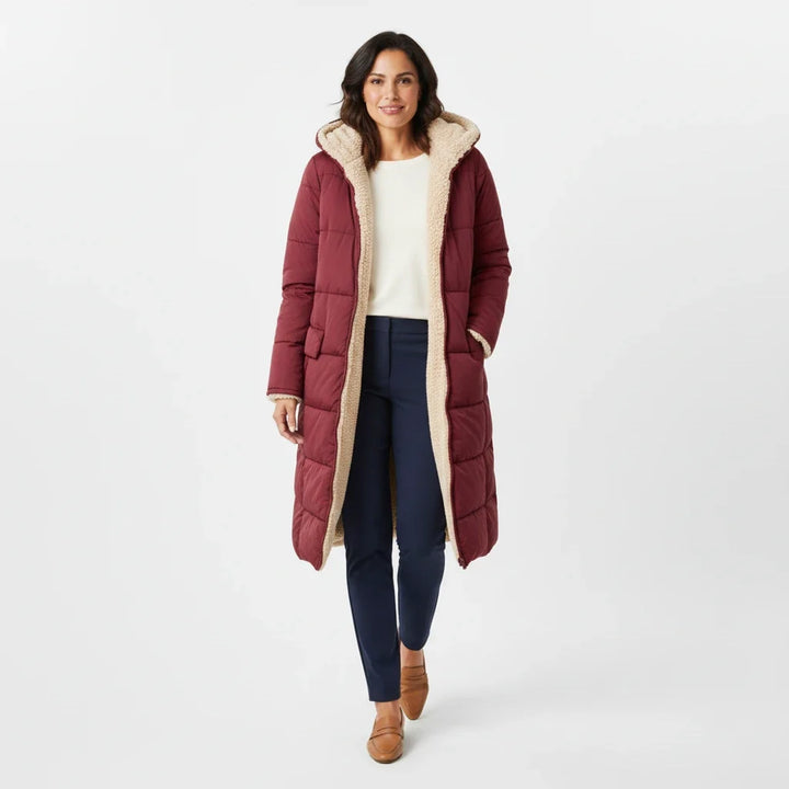 Elegant women's hooded winter coat, a warm and stylish oversized puffer jacket.