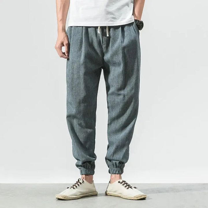 Close-up of soft, breathable cotton blend fabric on unisex lightweight comfort joggers, ideal for activewear.