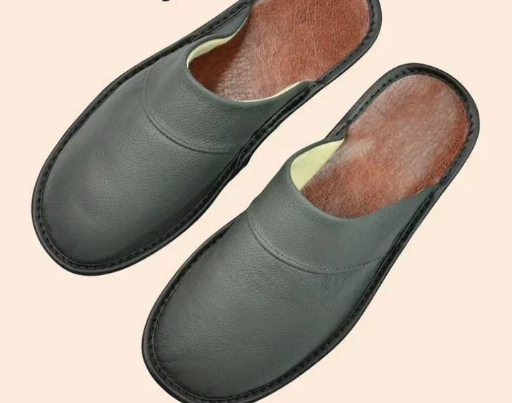 Black ultra-comfort men's slip-on indoor shoes, perfect for relaxation and home use.