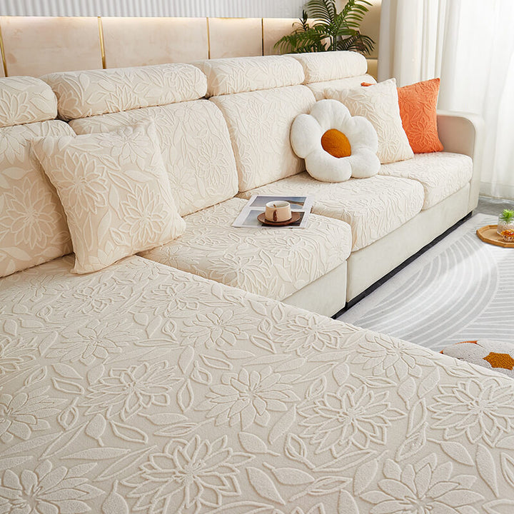 Elasticated velvet floral sofa slipcover on a modern couch, furniture protection