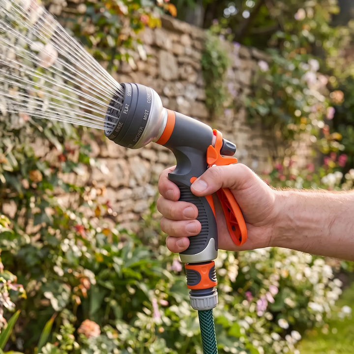 Versatile 8-pattern garden hose nozzle for watering plants, car washing & outdoor cleaning.