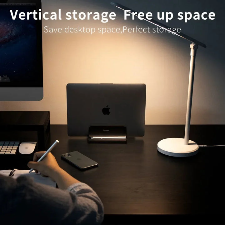 Sleek space-saving vertical laptop stand, decluttering your desk and organizing your tech accessories efficiently.