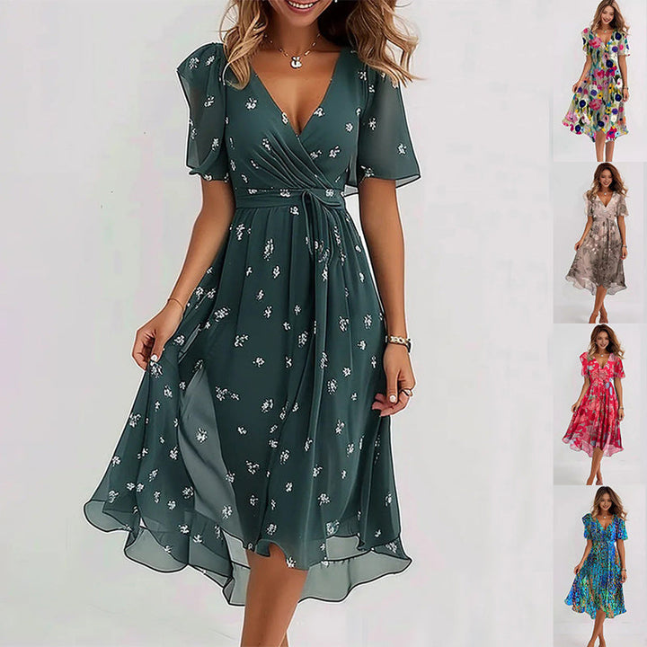 Flowy vibrant abstract midi dress, an elegant women's fashion piece with a colorful print for summer comfort.