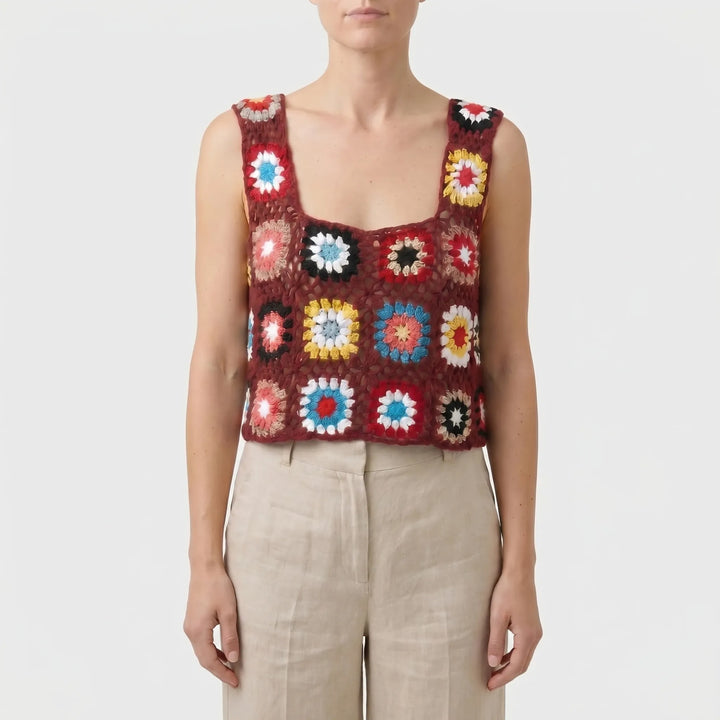 Vibrant bohemian sleeveless crop top for women. Colorful summer fashion statement piece, retro-inspired casual wear.