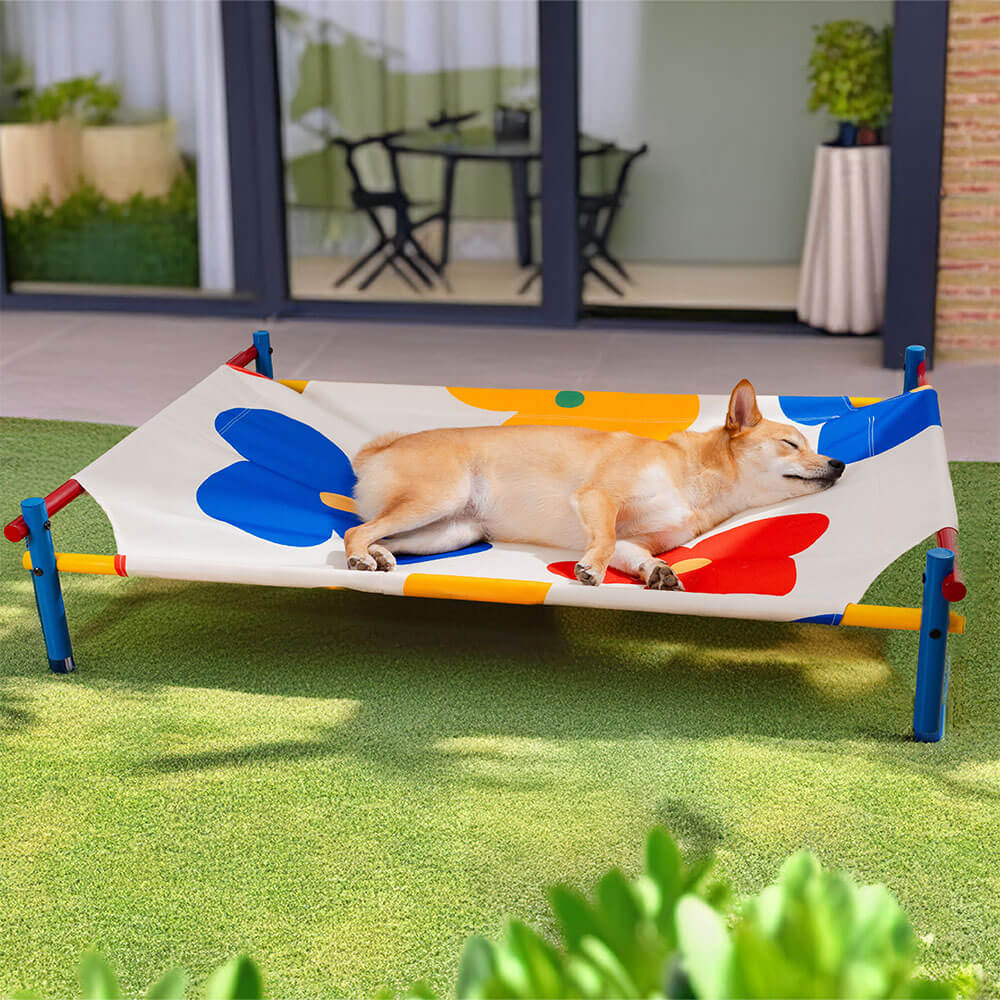 Elevated pet bed featuring a vivid summer print, aluminum frame for large dogs, outdoor use.