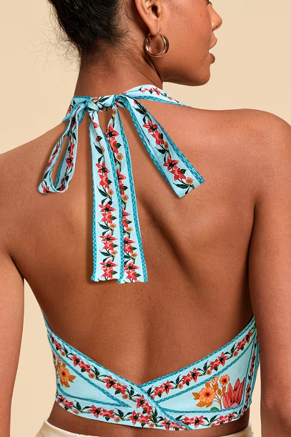 Trendy women's vibrant floral halter top, perfect for summer fashion & effortless style.