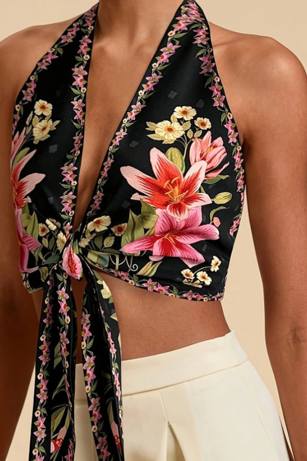 Women's vibrant floral halter top, great for vacations, beach, and stylish summer outfits.