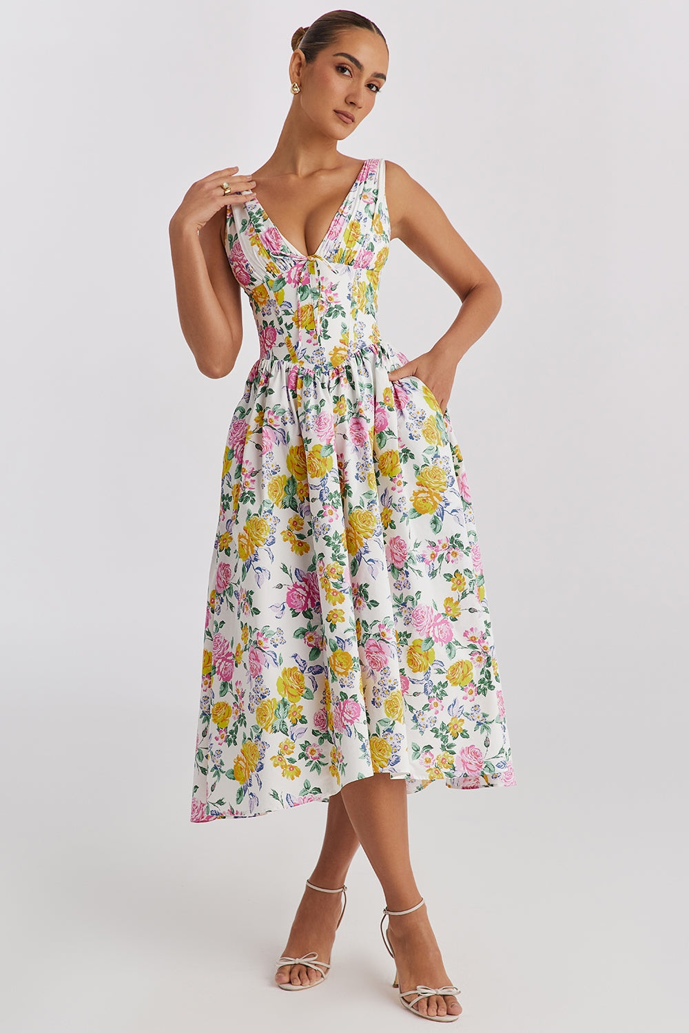 Vibrant floral midi wedding guest dress for women with a flattering corset V-neck & A-line silhouette.