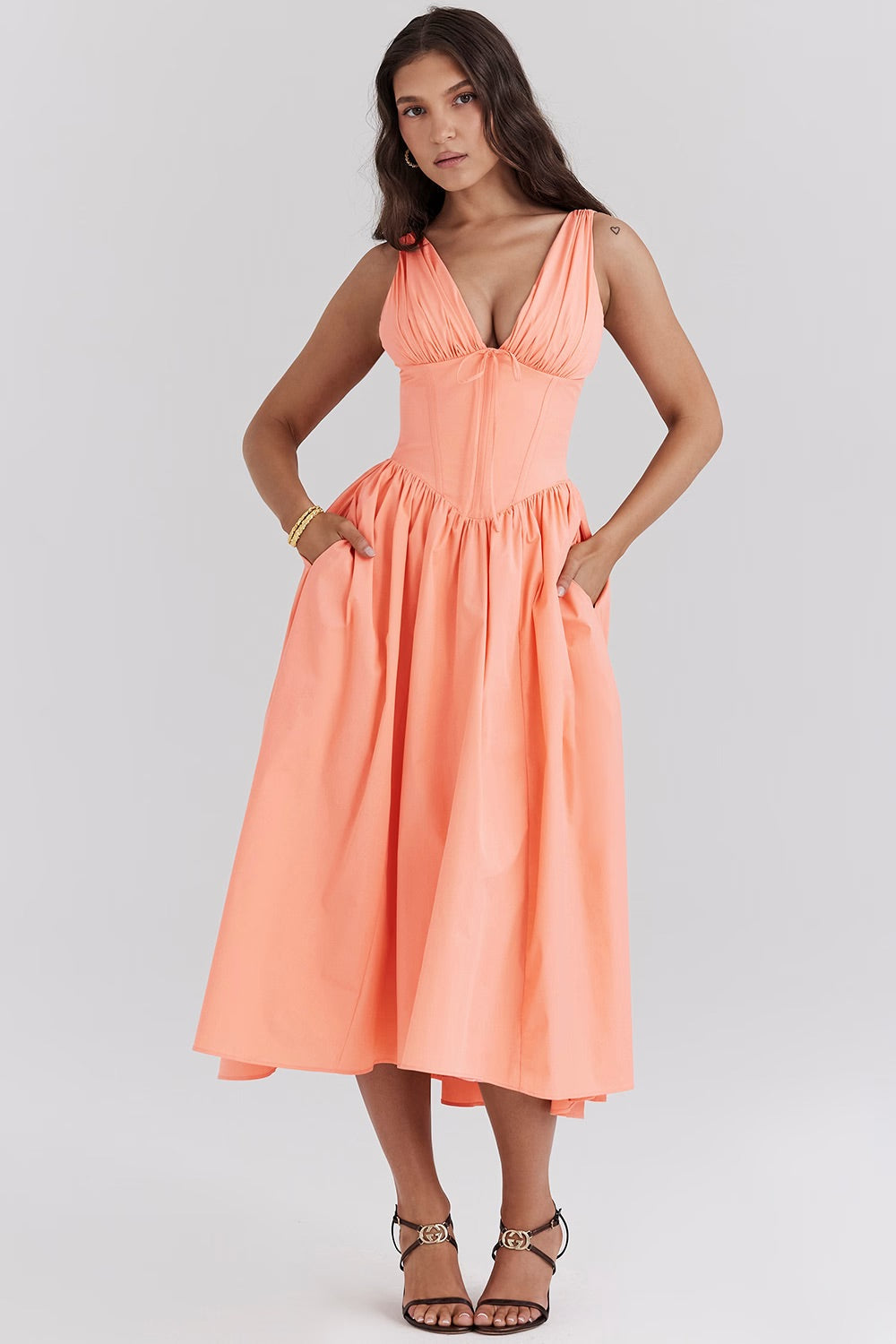 Stunning A-line floral midi dress for wedding guests, featuring a chic corset V-neck & vibrant pattern.