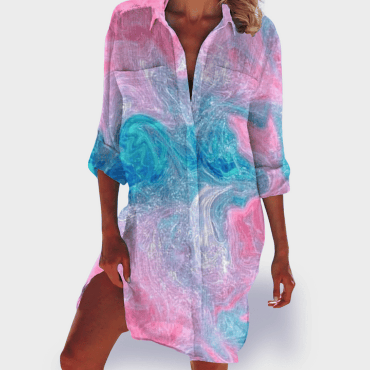 Women's vibrant colorful flowy draped midi dress with elegant silhouette, perfect for summer.