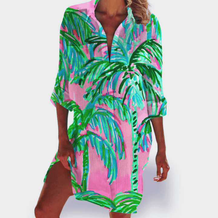 Brightly colored women's vibrant flowy draped midi dress, designed for effortless summer style.