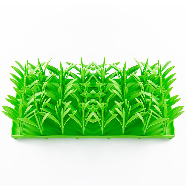 Vibrant green silicone pet feeding mat with grass design, non-slip base for dog or cat bowls