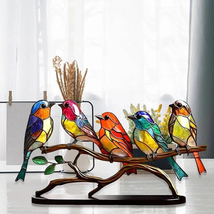 Artisanal stained glass bird suncatcher, a beautiful colorful art decor piece for any window or shelf.