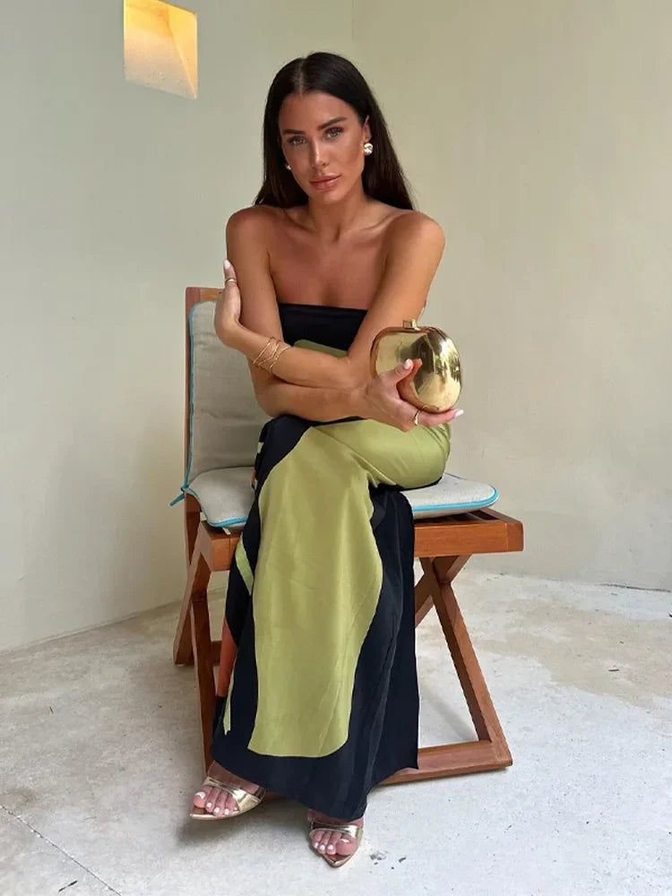 Flowy vibrant maxi dress in green, orange, blue, and lila. Strapless summer dress for elegant holiday vibes.