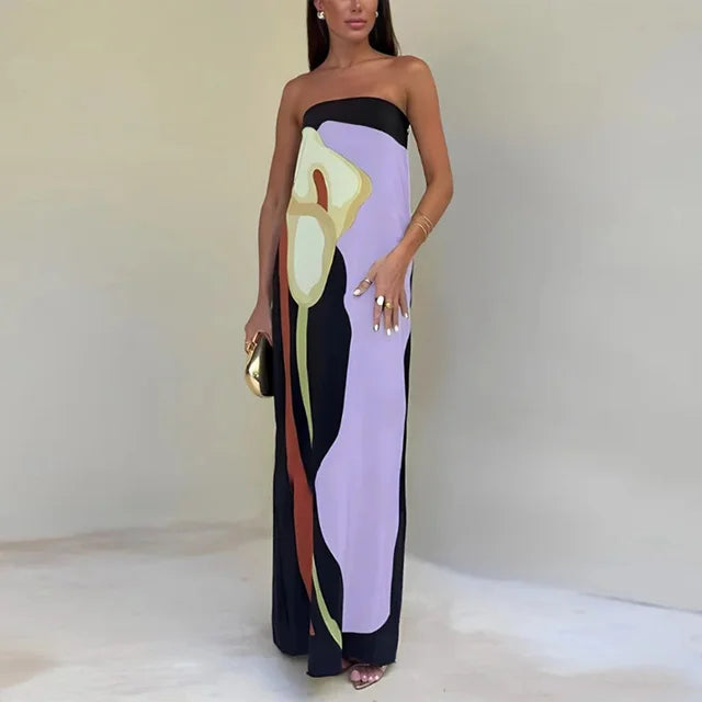 Vibrant green, orange, blue, lila printed maxi dress. Strapless summer style for bold holiday elegance.