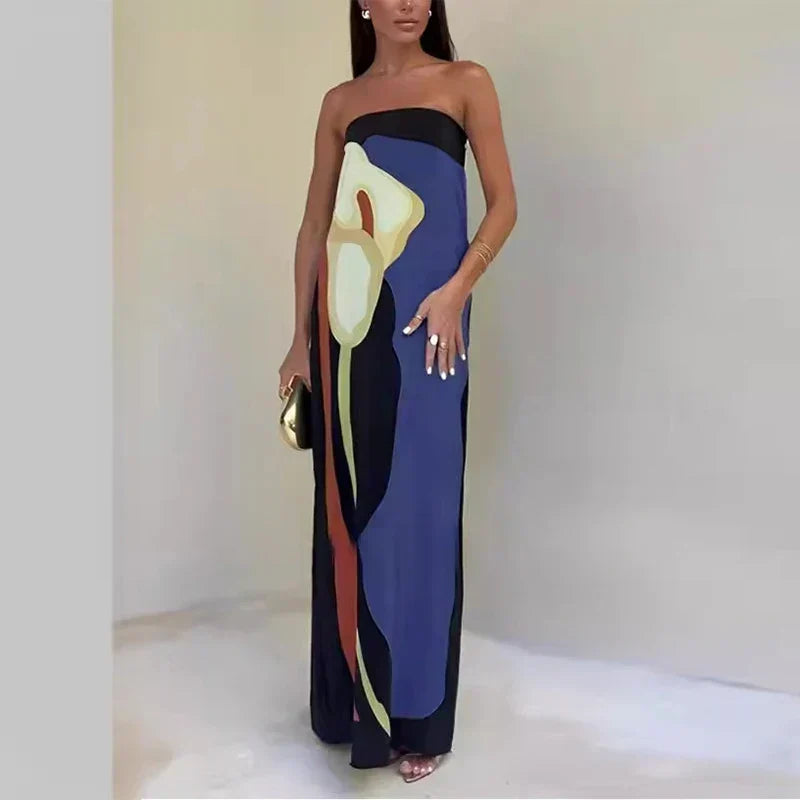 Bold vibrant print maxi dress for women. Off-shoulder summer holiday dress with flowy casual elegance.