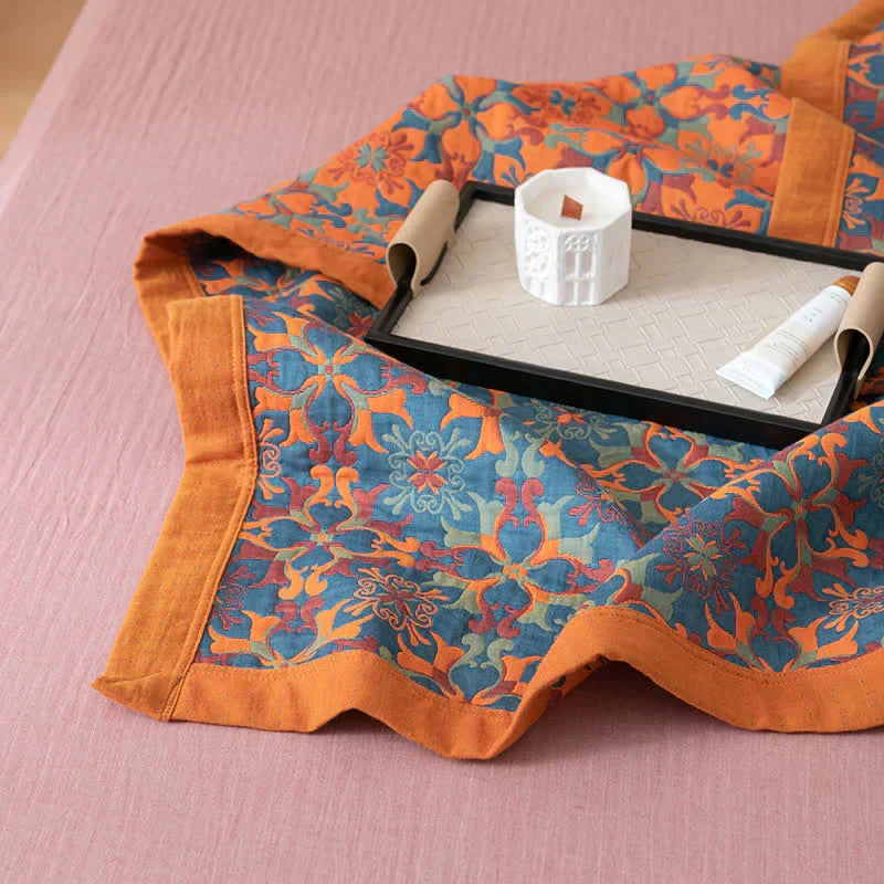 Eco-friendly six-layer cotton quilt with vibrant orange & blue pattern. Reversible duvet, ideal for cozy bedroom decor.