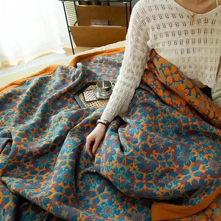 Stylish orange & blue patterned cotton quilt, six layers for comfort. Perfect reversible duvet for vibrant bedroom decor.