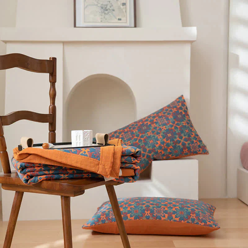 Comfortable six-layer cotton quilt in vibrant orange & blue, suitable for any bedroom decor. Eco-friendly bedding.